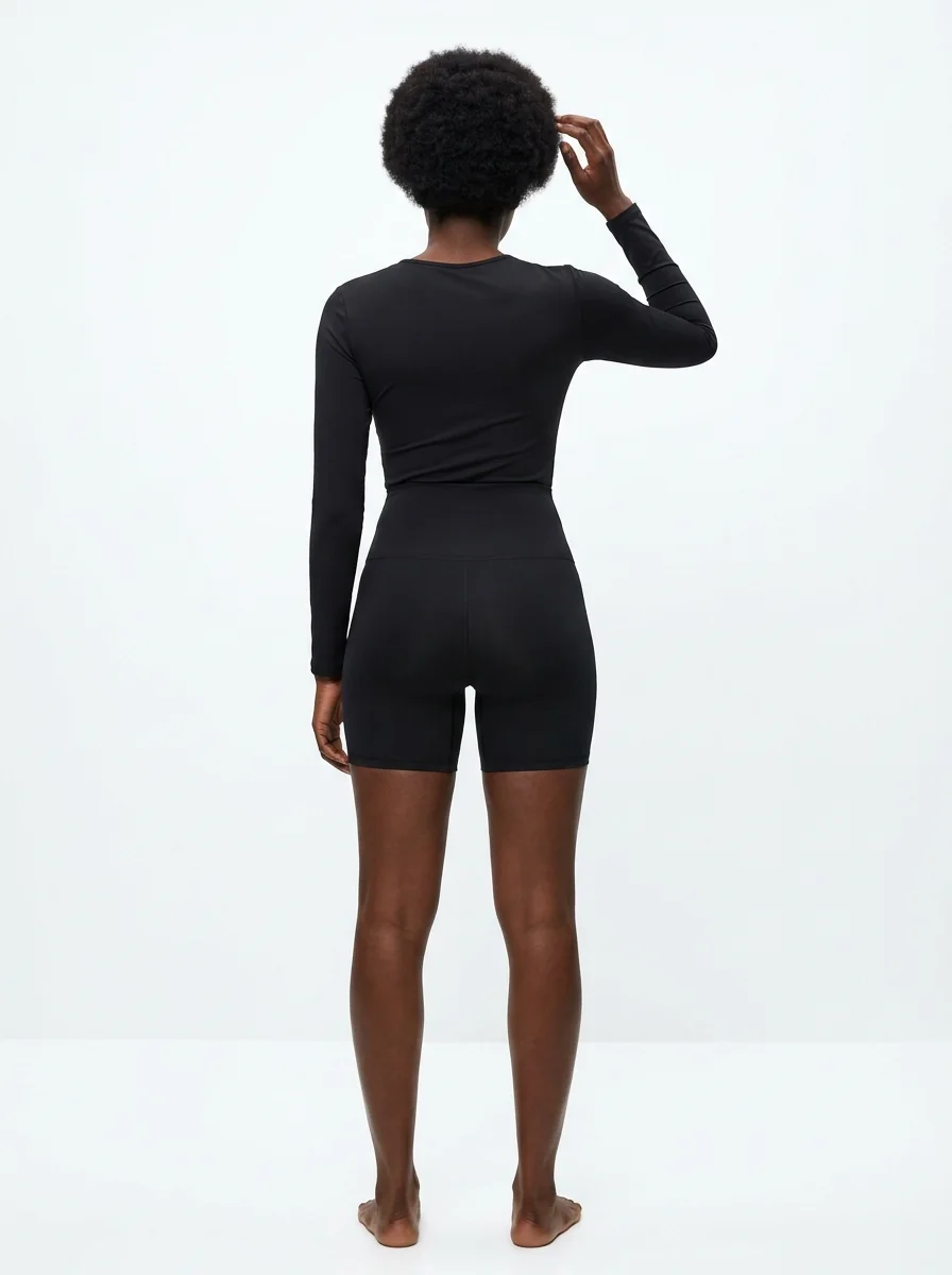 A model in a shaping garment, photographed from behind for Goals